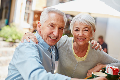 Buy stock photo Shot of a senior couple having coffee at a cafe