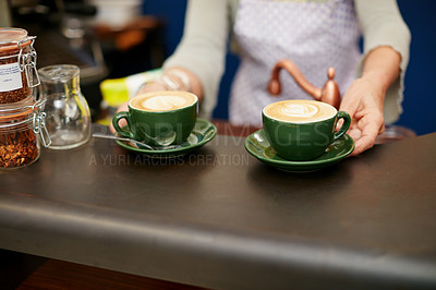 Buy stock photo Shot of creamy cappuccino in a coffee shop 