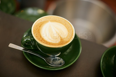 Buy stock photo Shot of creamy cappuccino in a coffee shop 