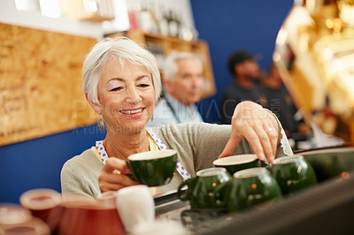 Buy stock photo Shot of a senior couple running a small business together