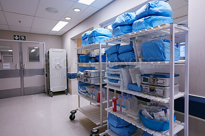 Buy stock photo Shot of shelves stocked with medical supplies in an empty hospital ward