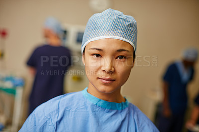 Buy stock photo Portrait of a confident surgeon standing in an operating room