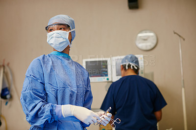 Buy stock photo Shot of a surgeon ready to perform a surgery in an operating room