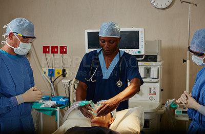 Buy stock photo Shot of a surgeon administering anesthetic to a patient before her surgery