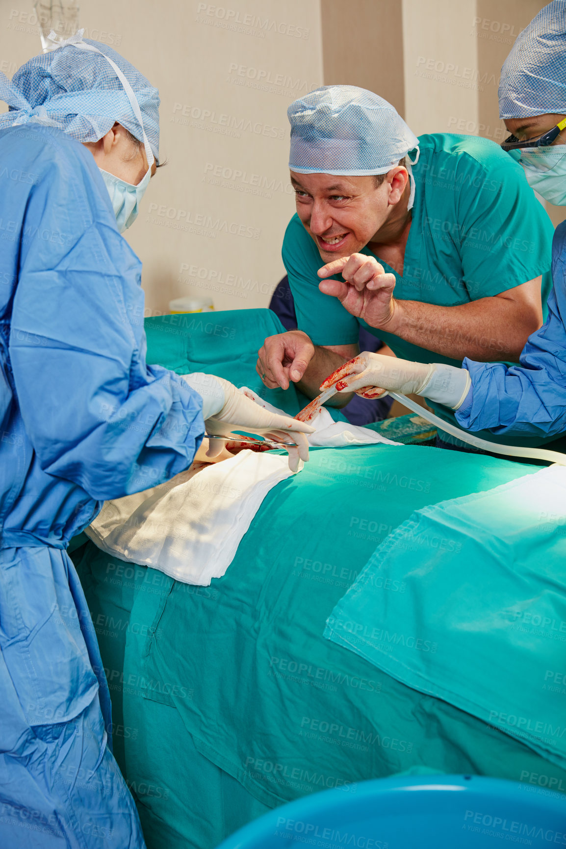 Buy stock photo Shot of a surgeon giving his colleague advice during a surgical procedure