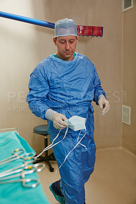 Buy stock photo Shot of a surgeon working in an operating room