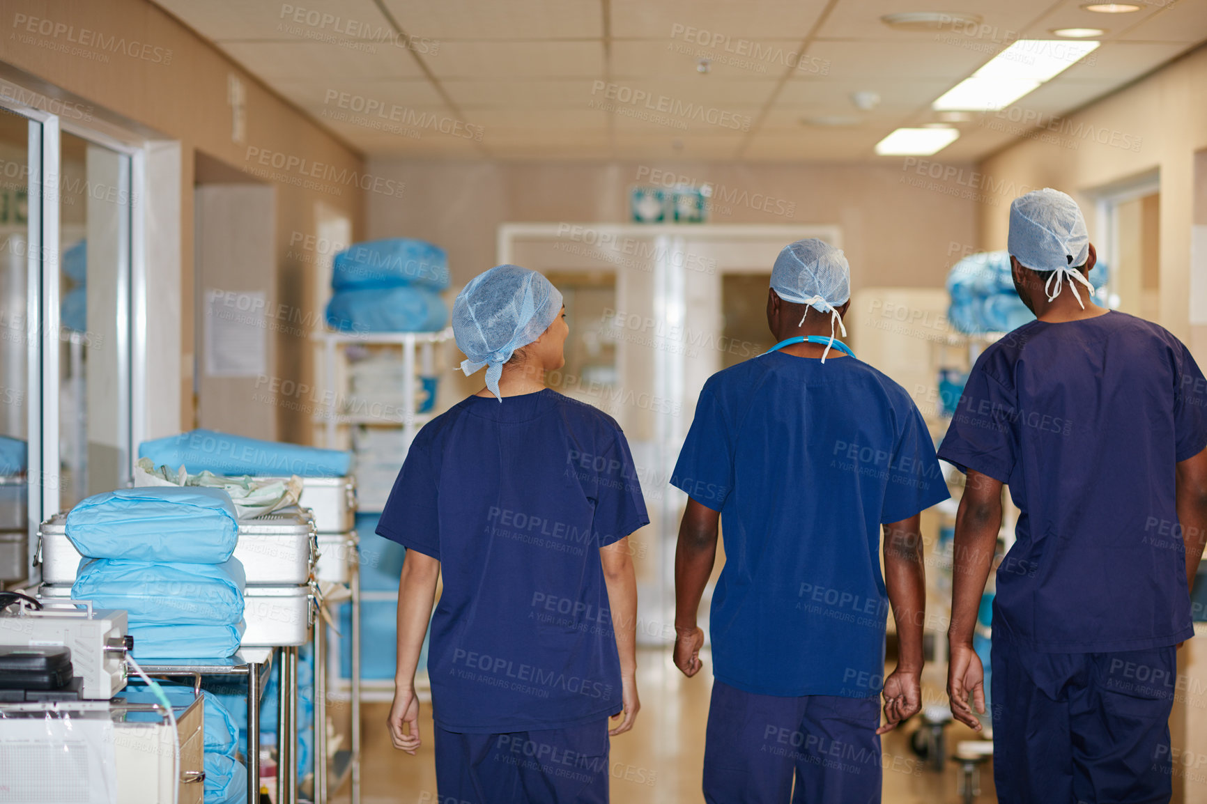Buy stock photo Rearview shot of medical staff in a hospital