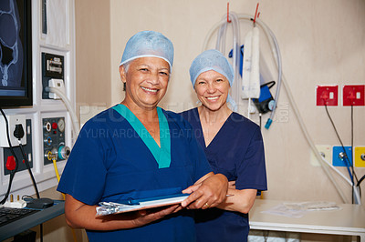 Buy stock photo Portrait of two surgeons working in a hospital