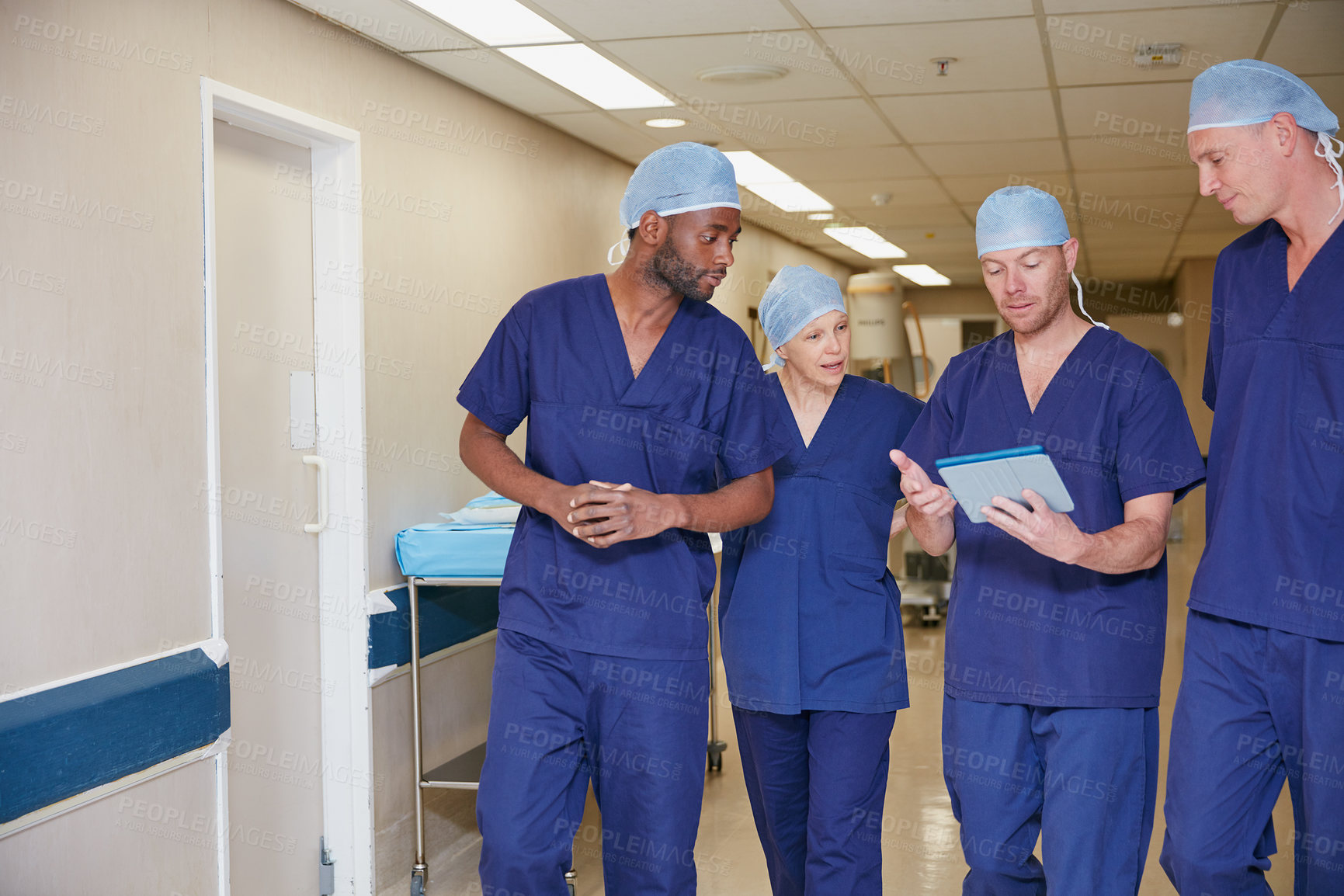 Buy stock photo Cropped shot of a medical team standing in a hospital