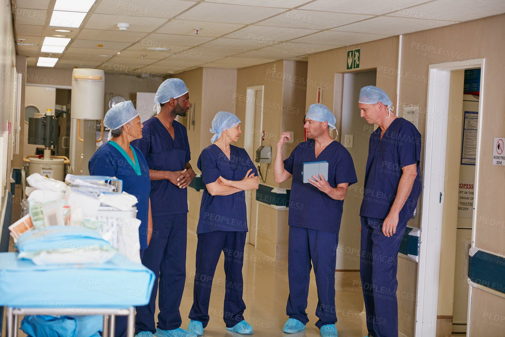Buy stock photo Full length shot of a medical team standing in a hospital