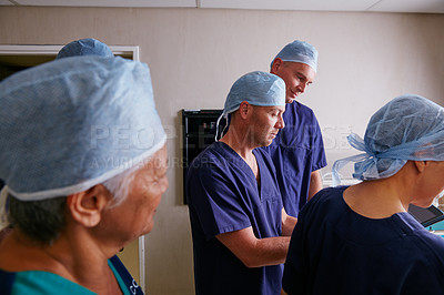 Buy stock photo Cropped shot of a medical team in the hospital