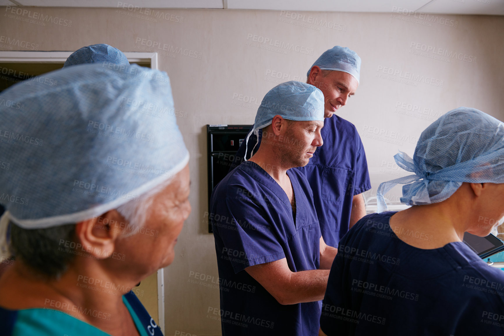 Buy stock photo Cropped shot of a medical team in the hospital