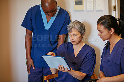 Buy stock photo Cropped shot of three medical professionals in the hospital