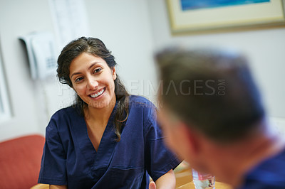 Buy stock photo Shot of medical practitioners having a chat while on their tea break