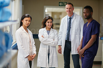 Buy stock photo Portrait of a medical team standing together in a hospital