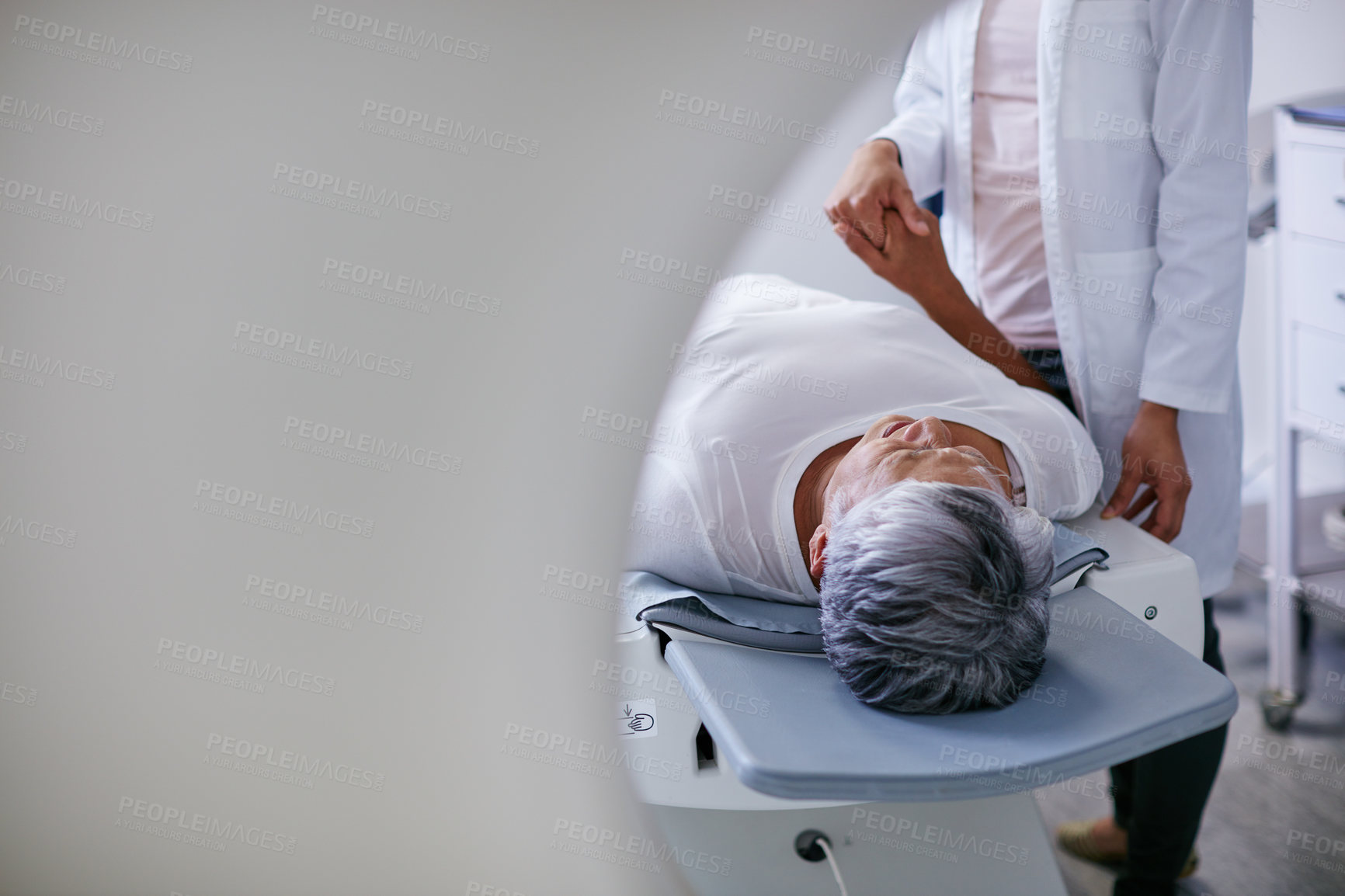 Buy stock photo Doctor, mri and woman holding hands of patient in hospital before scanning in machine. Ct scan, cancer and medical professional with senior person in radiology test for healthcare in clinic.