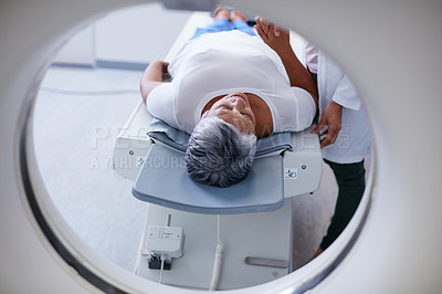 Buy stock photo Shot of a senior woman being comforted by a doctor before and MRI scan