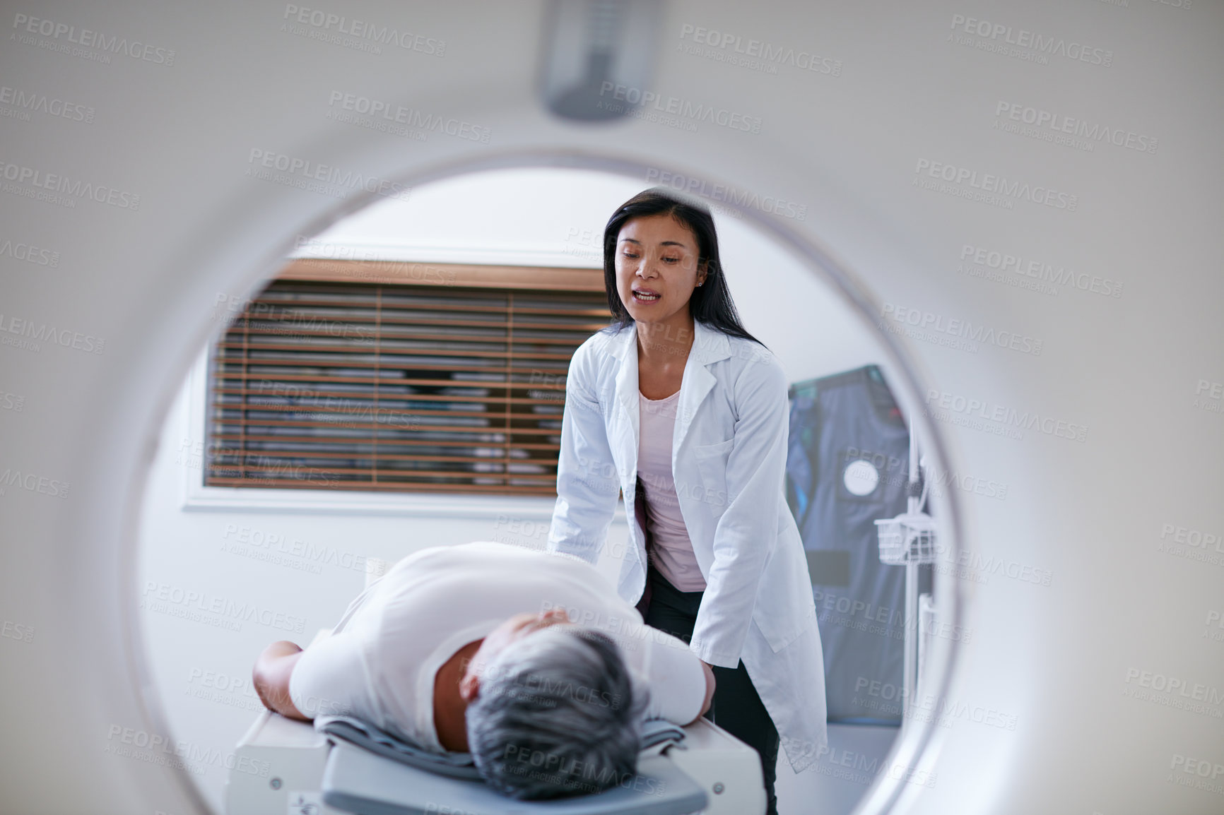 Buy stock photo Doctor, mri and woman with patient in hospital ready to start scanner machine. Ct scan, examination and medical professional with senior person before cancer radiology test for healthcare in clinic.