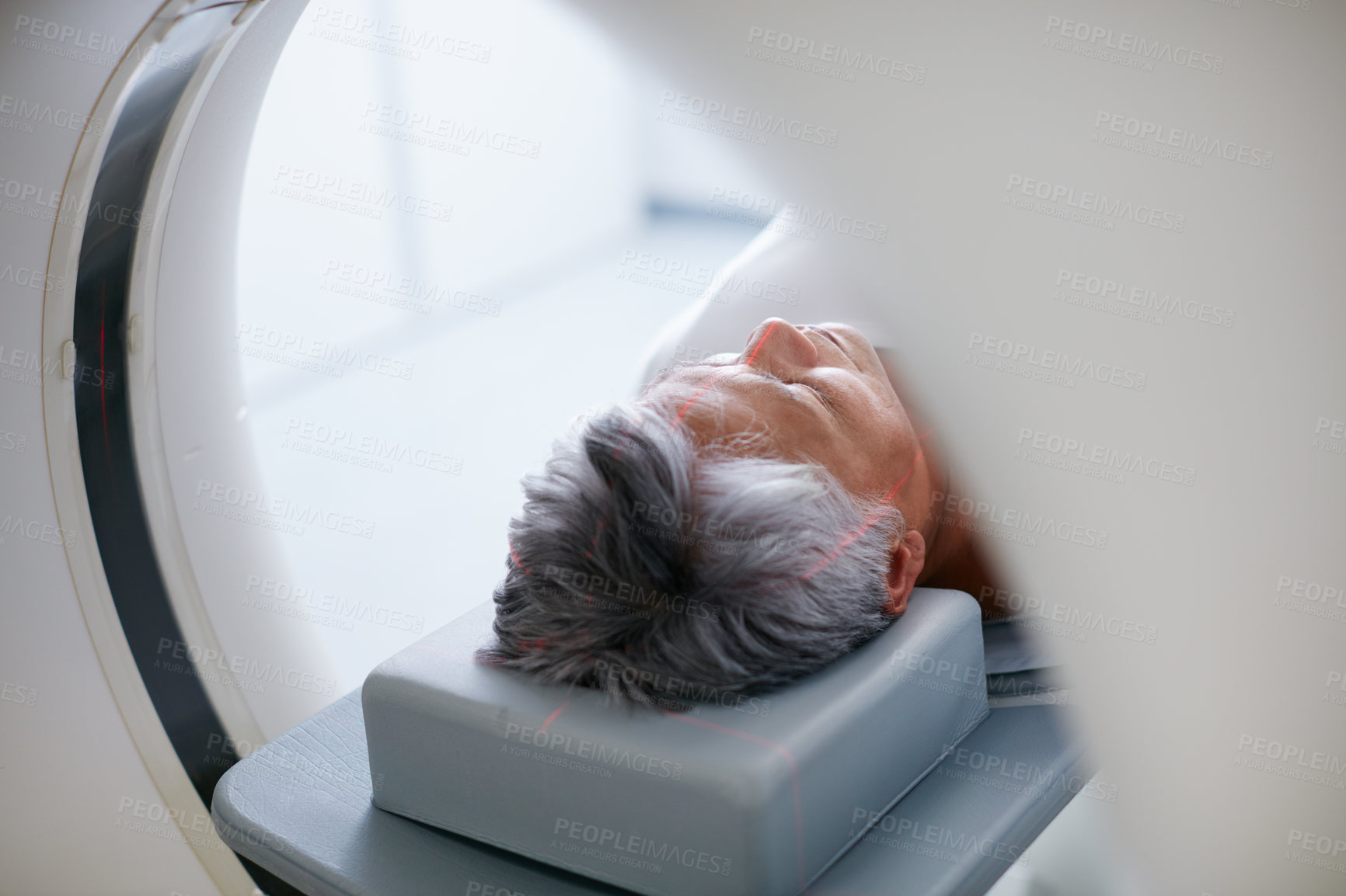 Buy stock photo Shot of a senior woman about to have an MRI scan