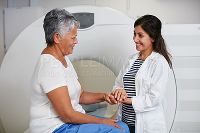 Buy stock photo Doctor, ct scan and woman holding hands of patient in hospital before scanning in machine. Mri, comfort and happy medical professional with senior female person before radiology test for healthcare.