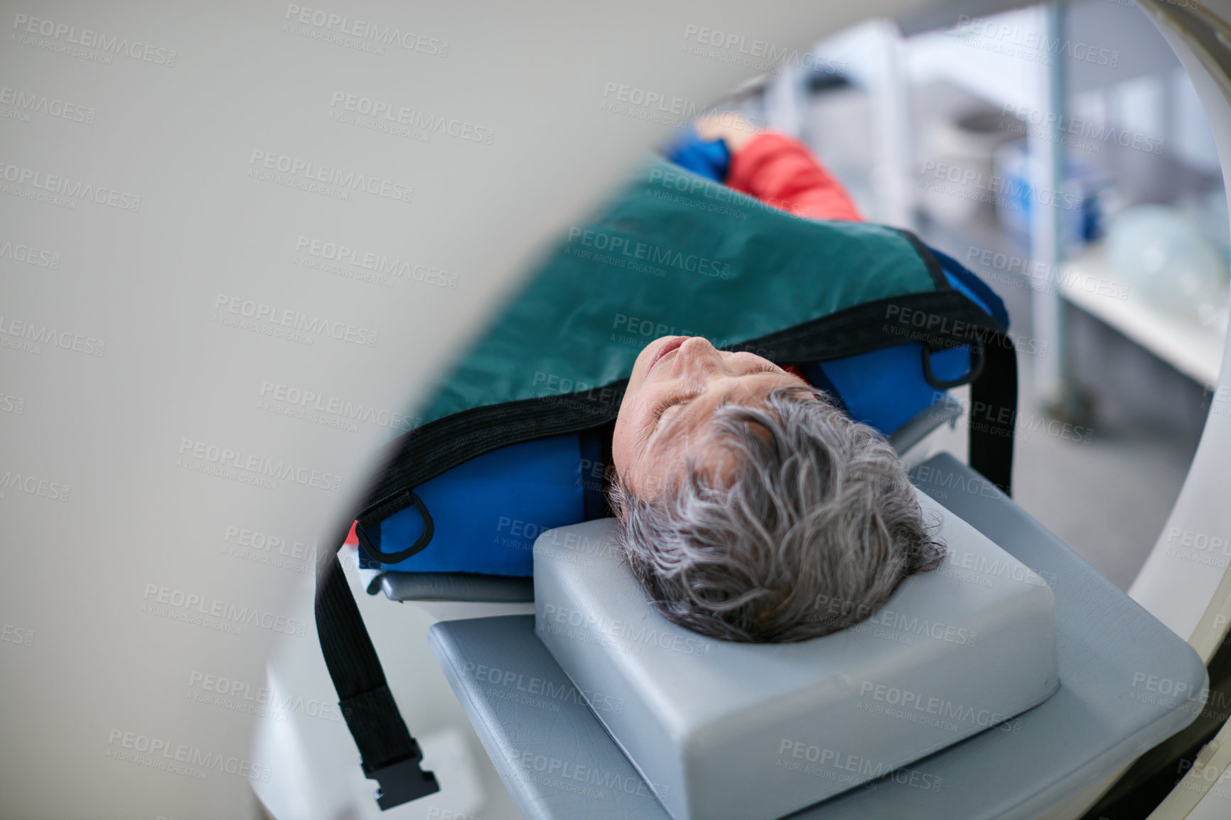 Buy stock photo Shot of a mature woman about to have an MRI scan