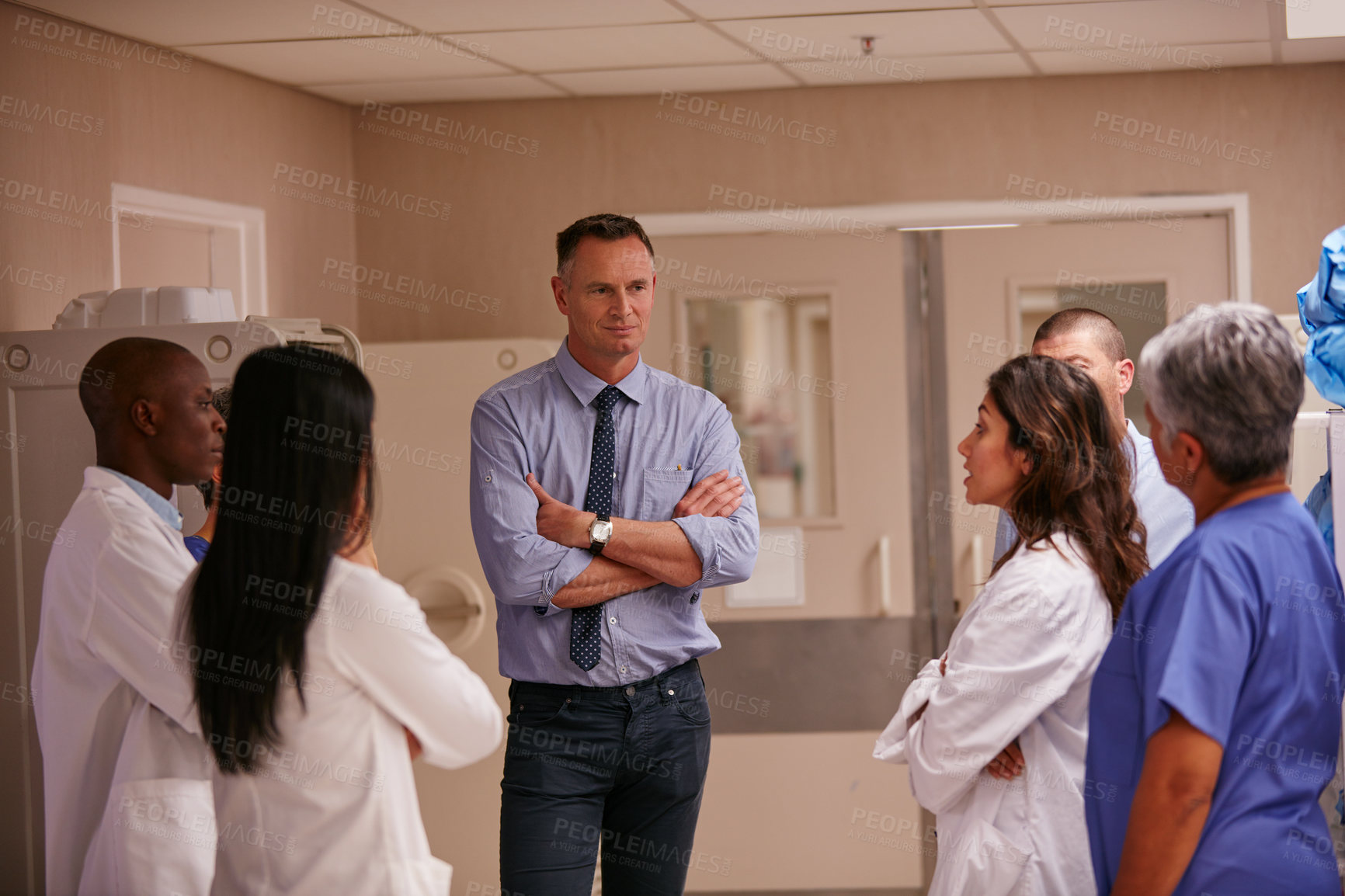 Buy stock photo Shot of a medical team having a discussion in a hospital