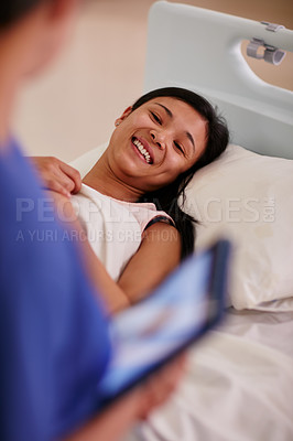 Buy stock photo Cropped shot of a patient talking to her nurse