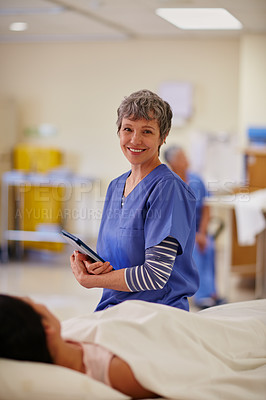 Buy stock photo Portrait of a nurse standing by her patient's bedside