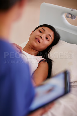 Buy stock photo Cropped shot of a patient talking to her nurse