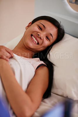 Buy stock photo Portrait of a young woman lying in hospital