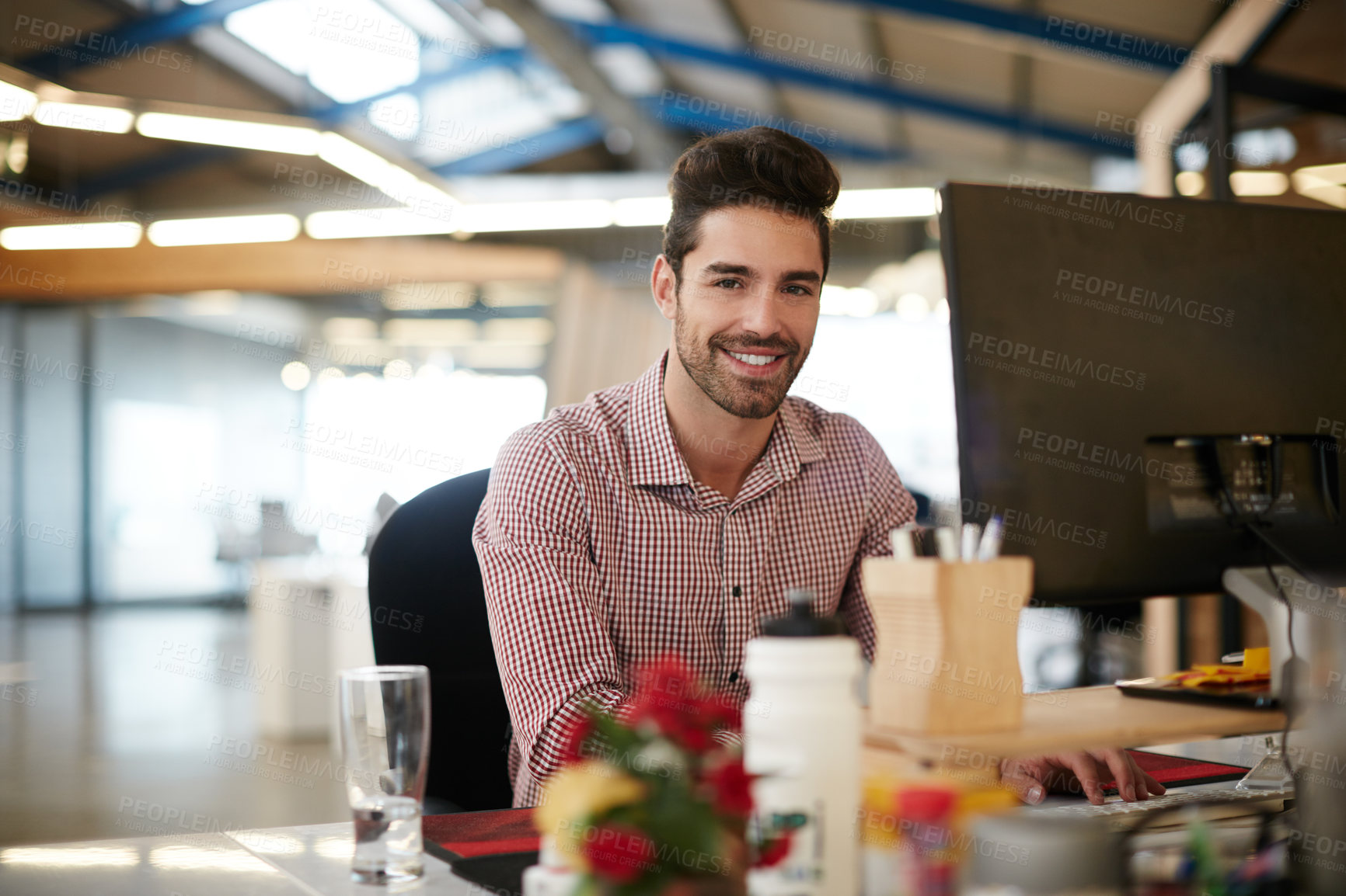 Buy stock photo Journalist, portrait or man in office with happiness, experience or pride in media job. Confidence, creative or male person in newsroom with tech, press or career growth in publishing industry.
