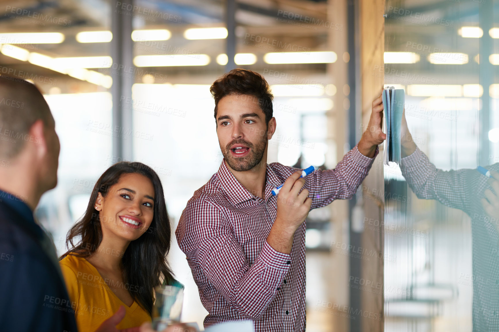 Buy stock photo Cropped shot of three businesspeople working in the office