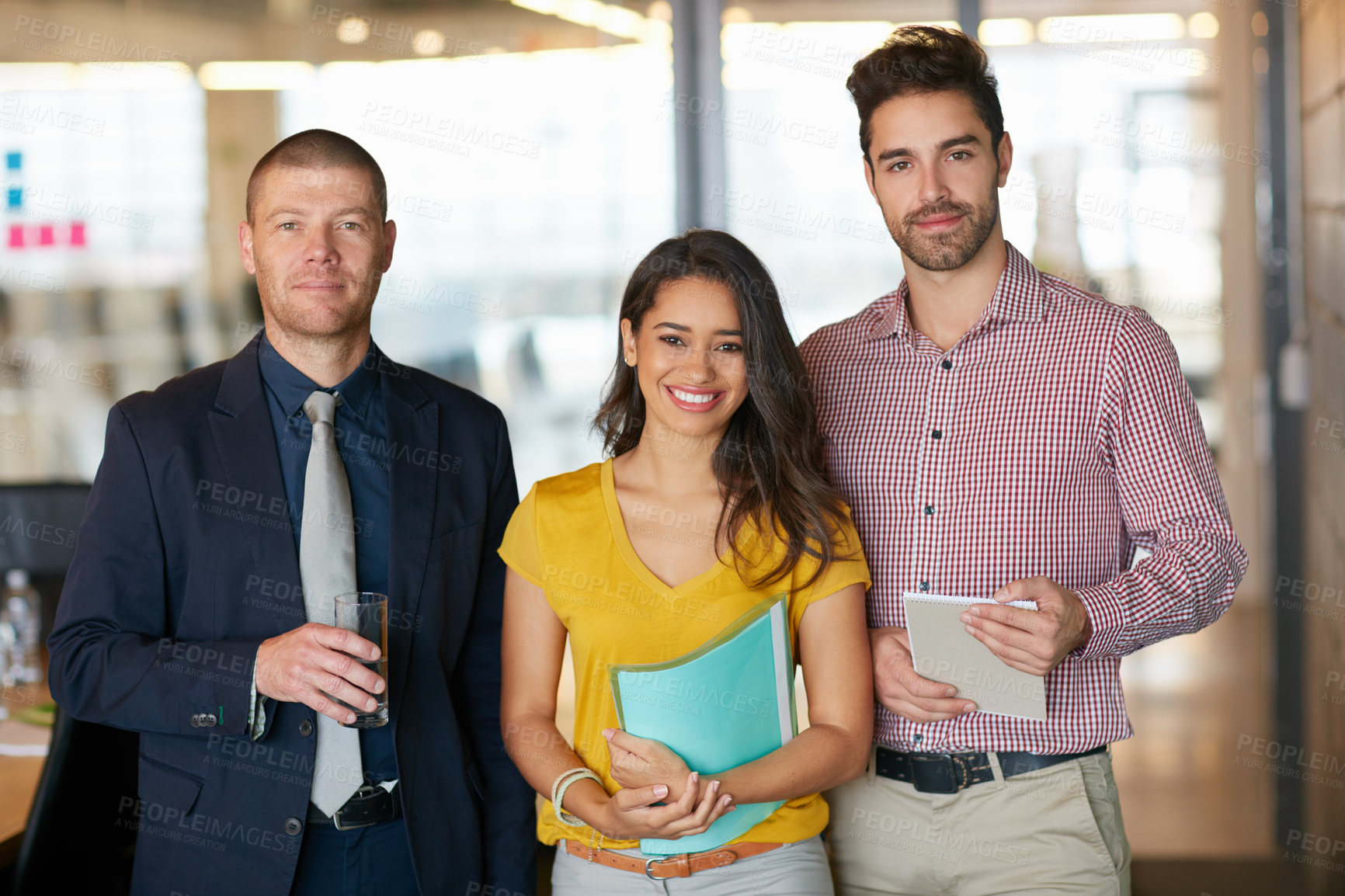 Buy stock photo Cropped portrait of three businesspeople standing in the office