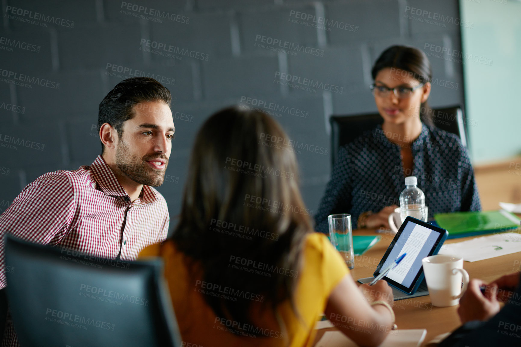 Buy stock photo Business people, meeting and creative discussion with tablet for project planning or brainstorming. Group, employees or colleagues with technology for company design, ideas or collaboration in office