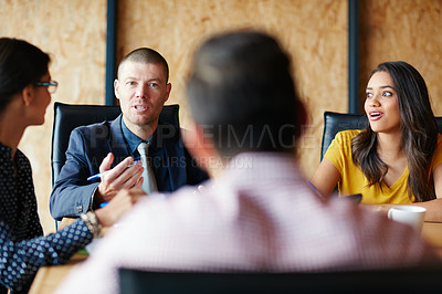 Buy stock photo Shot of a group of colleagues having a meeting in a boardroom