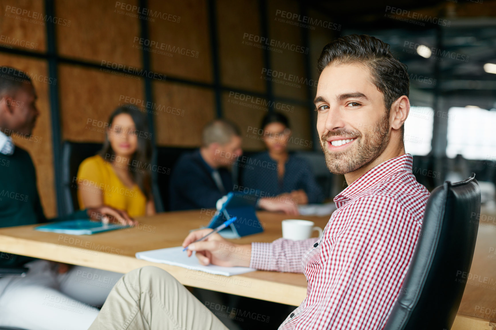 Buy stock photo Portrait of an office worker in a meeting with colleagues in the background