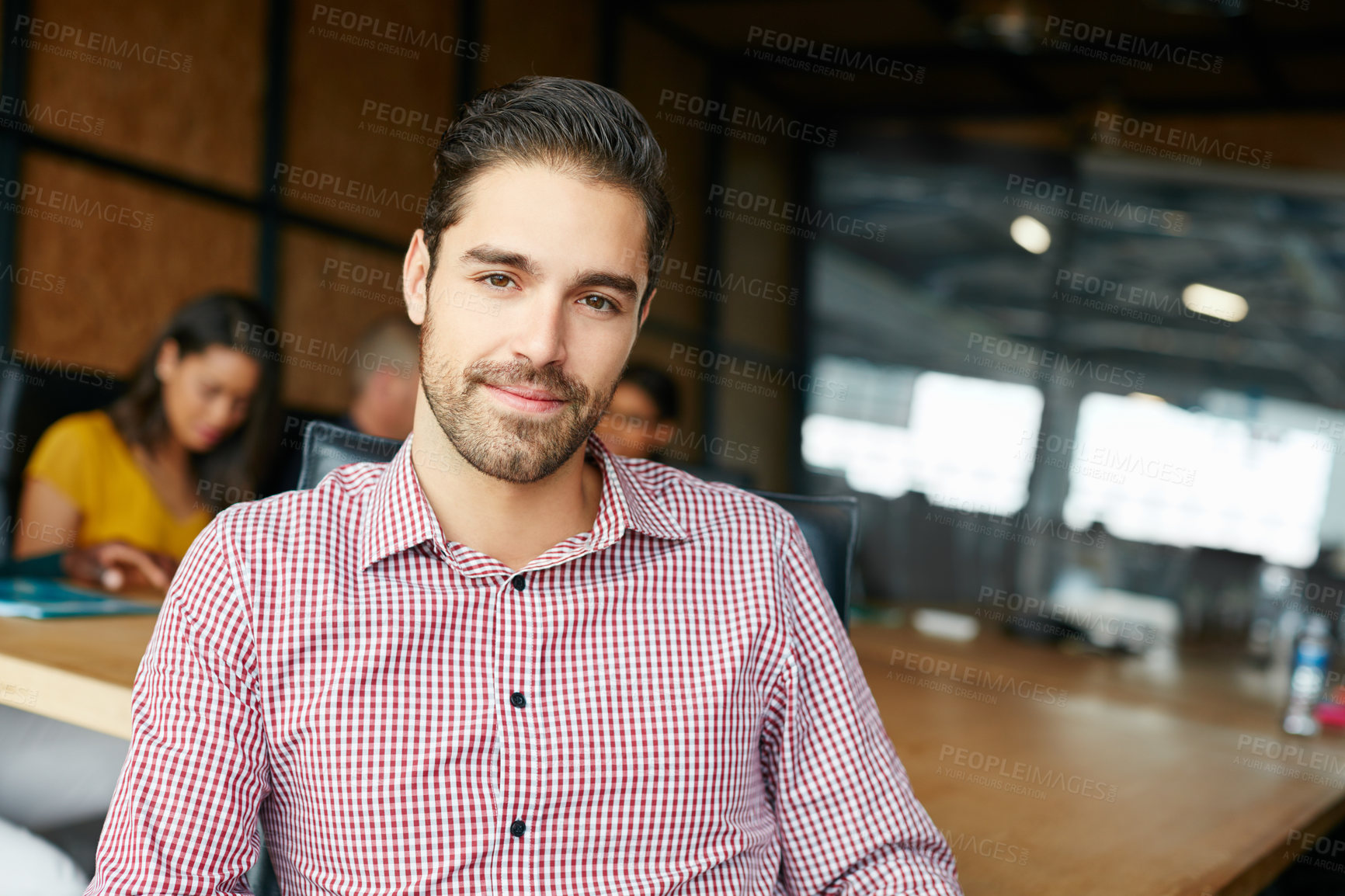 Buy stock photo Portrait of an office worker in a meeting with colleagues in the background