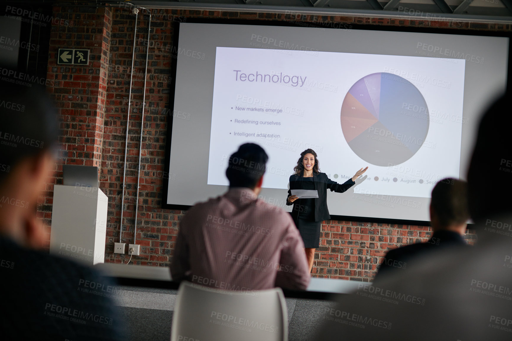 Buy stock photo Shot of a businesswoman giving a presentation to her colleagues