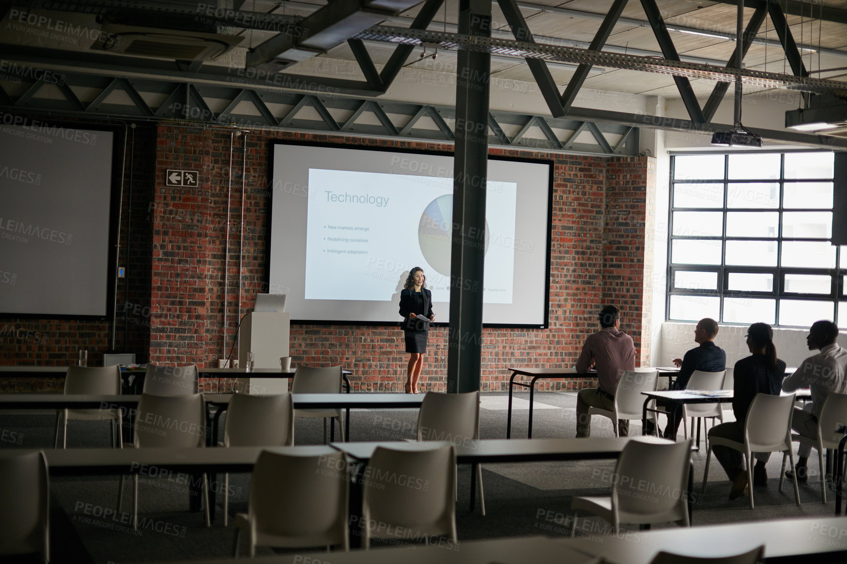 Buy stock photo Shot of a businesswoman giving a presentation to her colleagues