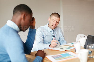 Buy stock photo Cropped shot of two businessmen working in the office