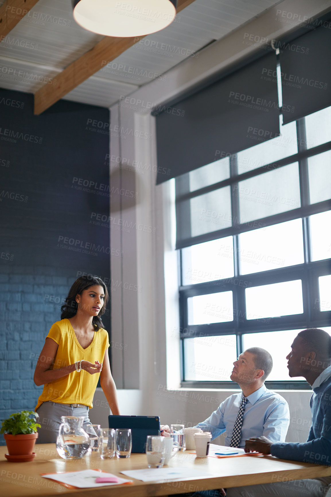 Buy stock photo Cropped shot of three businesspeople in the office