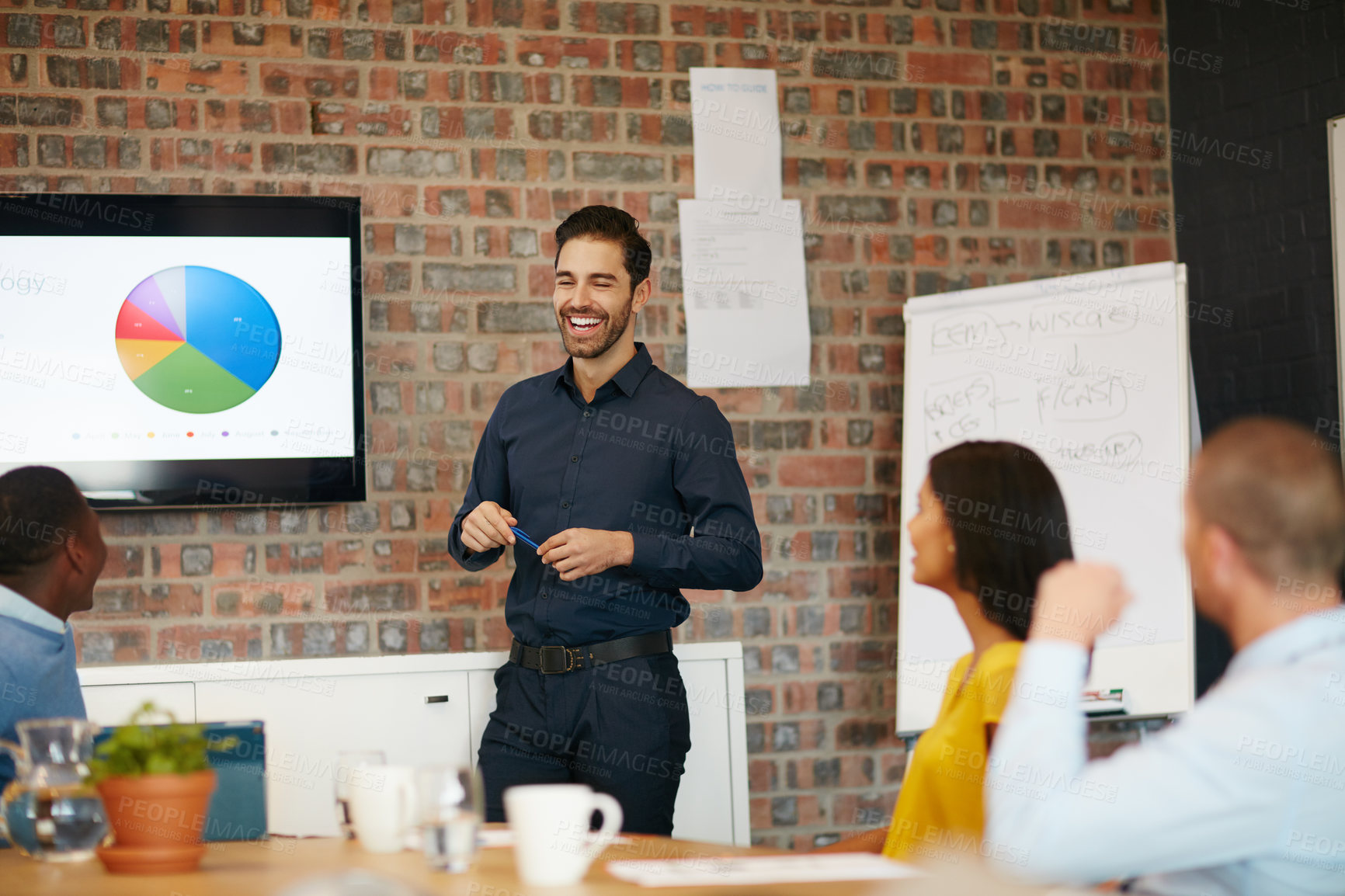 Buy stock photo Cropped shot of a young businessman giving a presentation in the boardroom