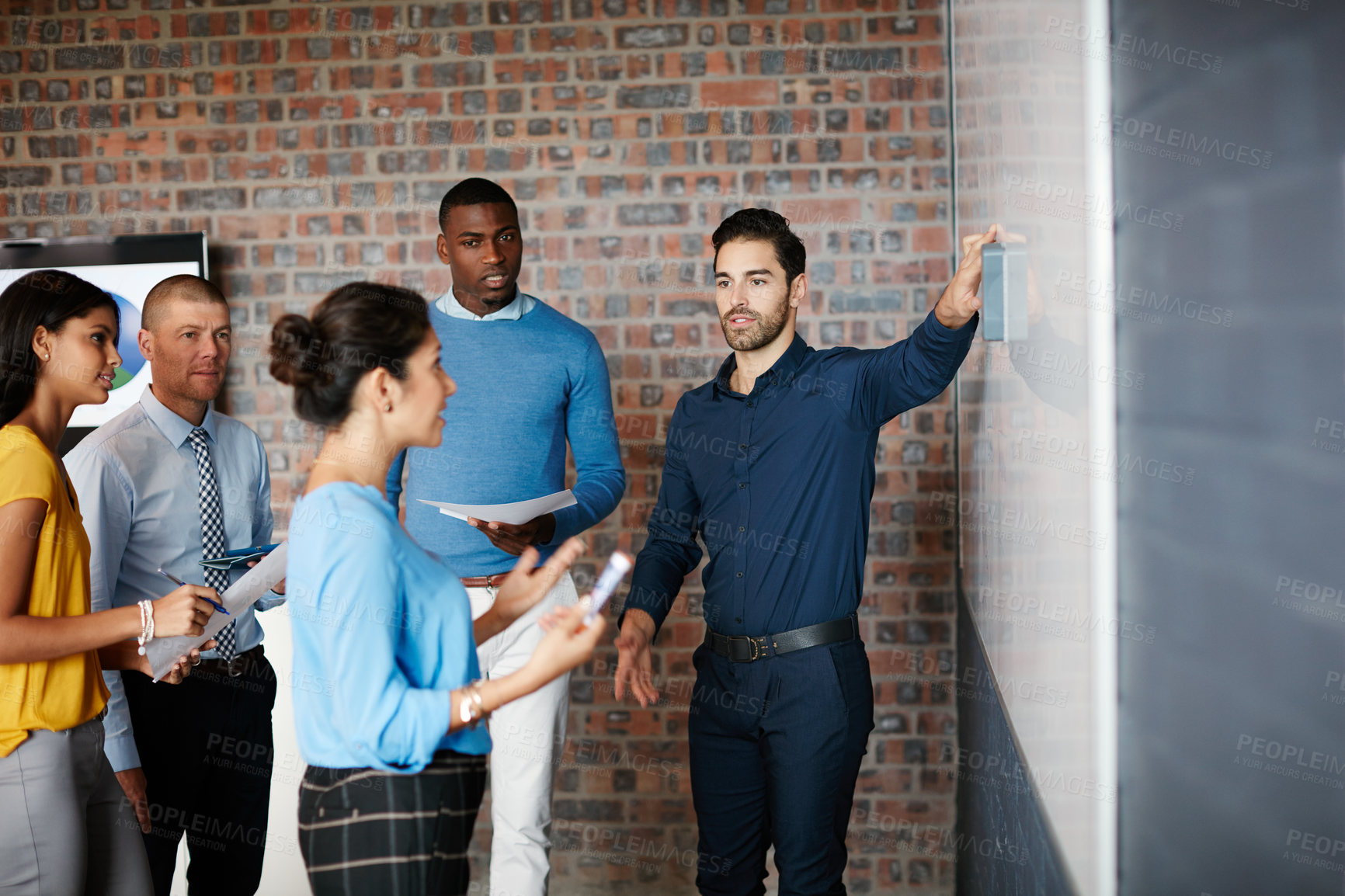 Buy stock photo Cropped shot of a group of businesspeople in the boardroom