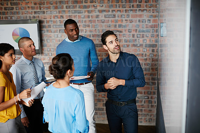 Buy stock photo Cropped shot of a group of businesspeople in the boardroom