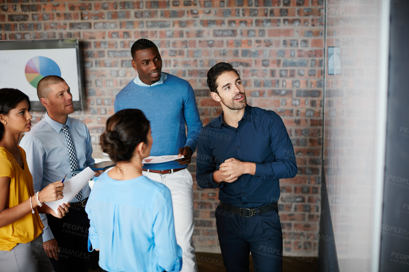 Buy stock photo Cropped shot of a group of businesspeople in the boardroom