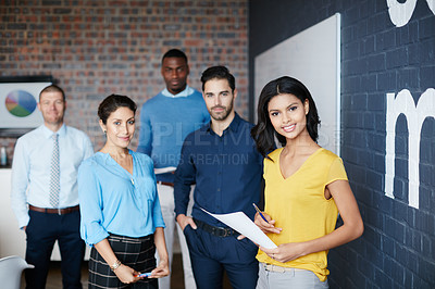 Buy stock photo Cropped portrait of a group of businesspeople standing in the workplace