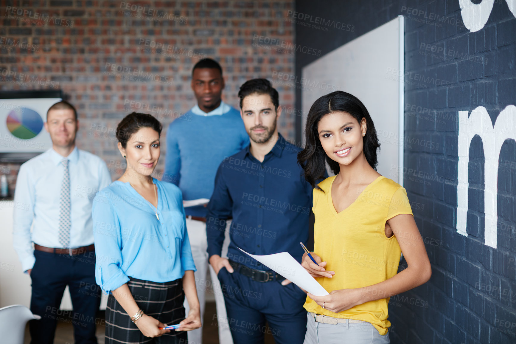 Buy stock photo Cropped portrait of a group of businesspeople standing in the workplace