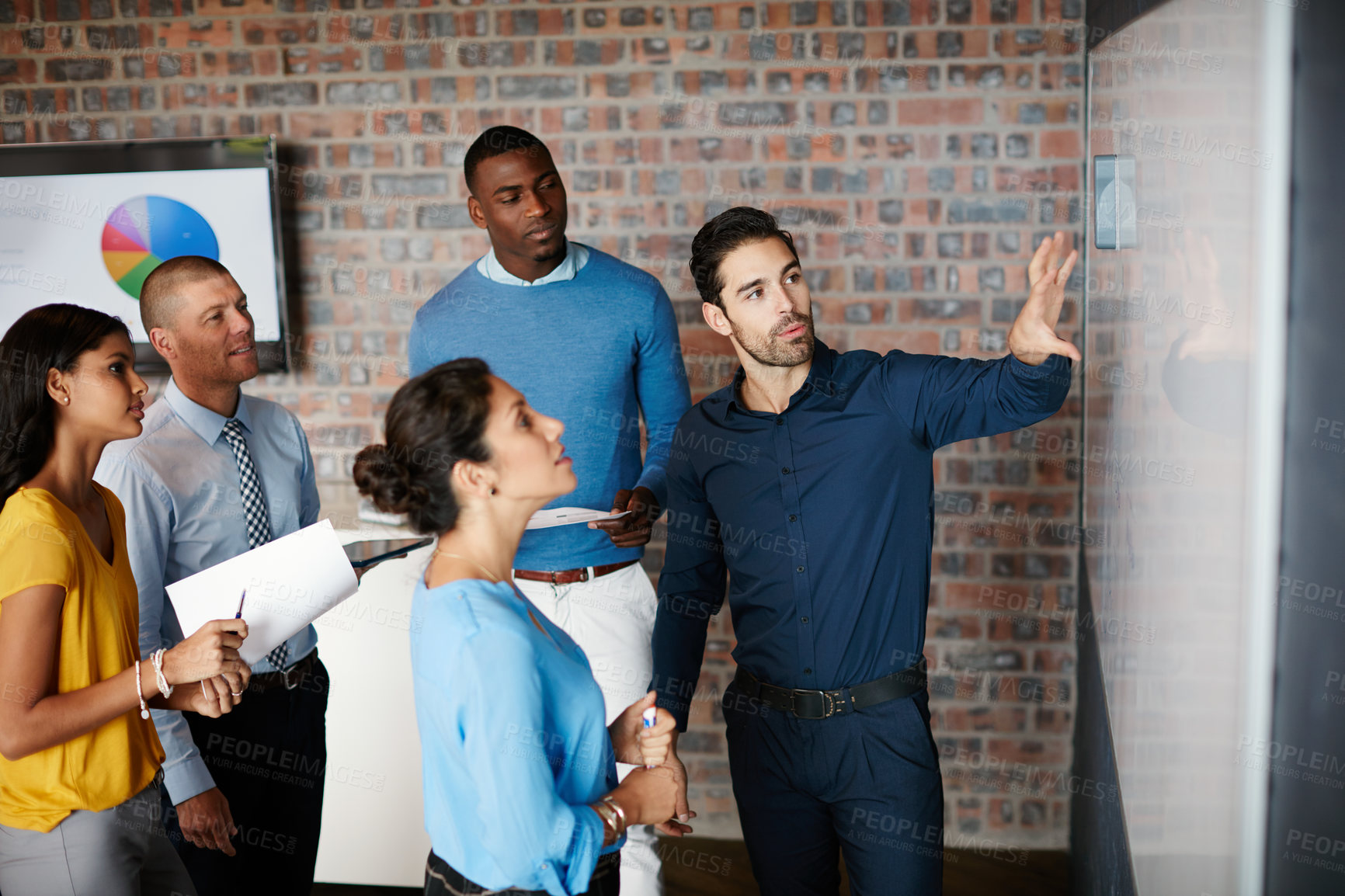 Buy stock photo Cropped shot of a group of businesspeople in the boardroom