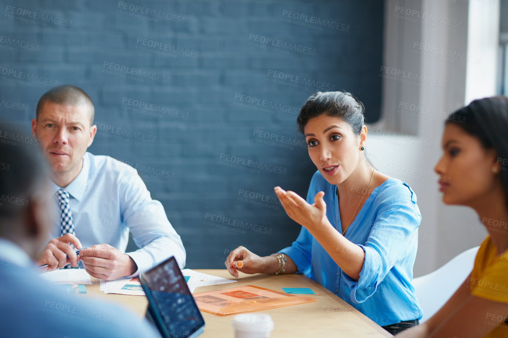 Buy stock photo Cropped shot of a group of businesspeople in the boardroom