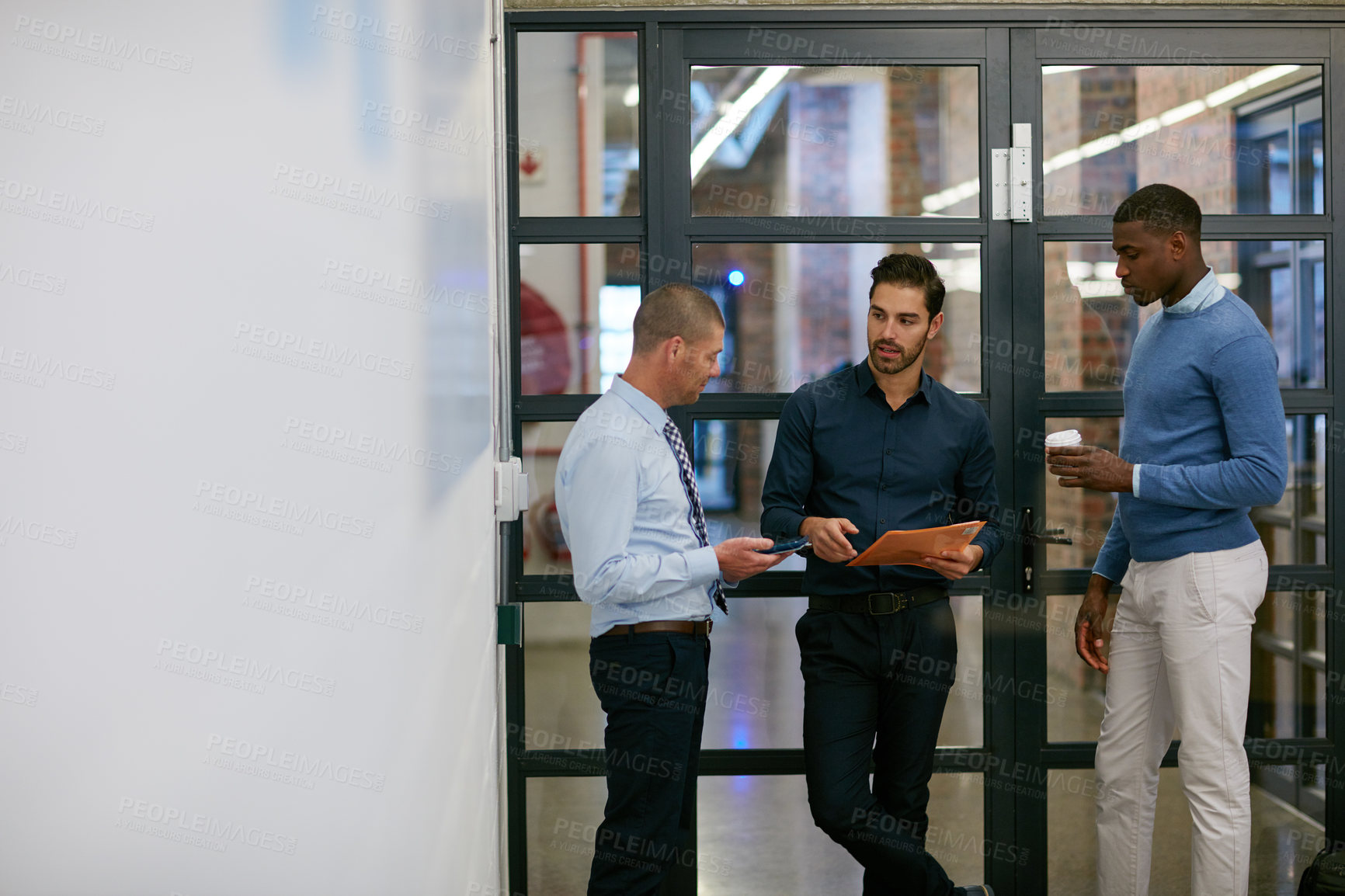 Buy stock photo Cropped shot of three businessmen in the office